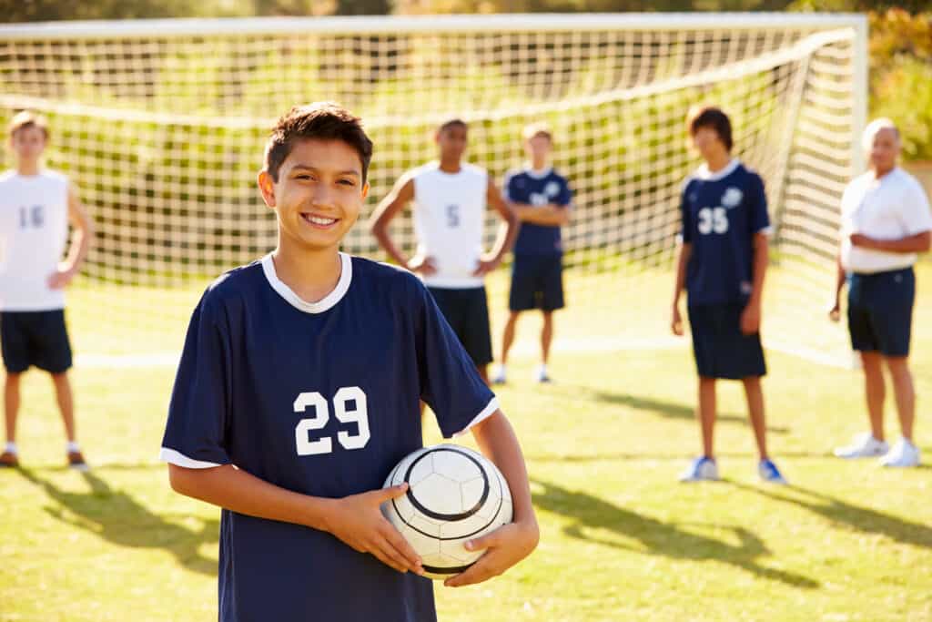 A homeschooled student playing on a soccer team as part of a middle school physical education elective