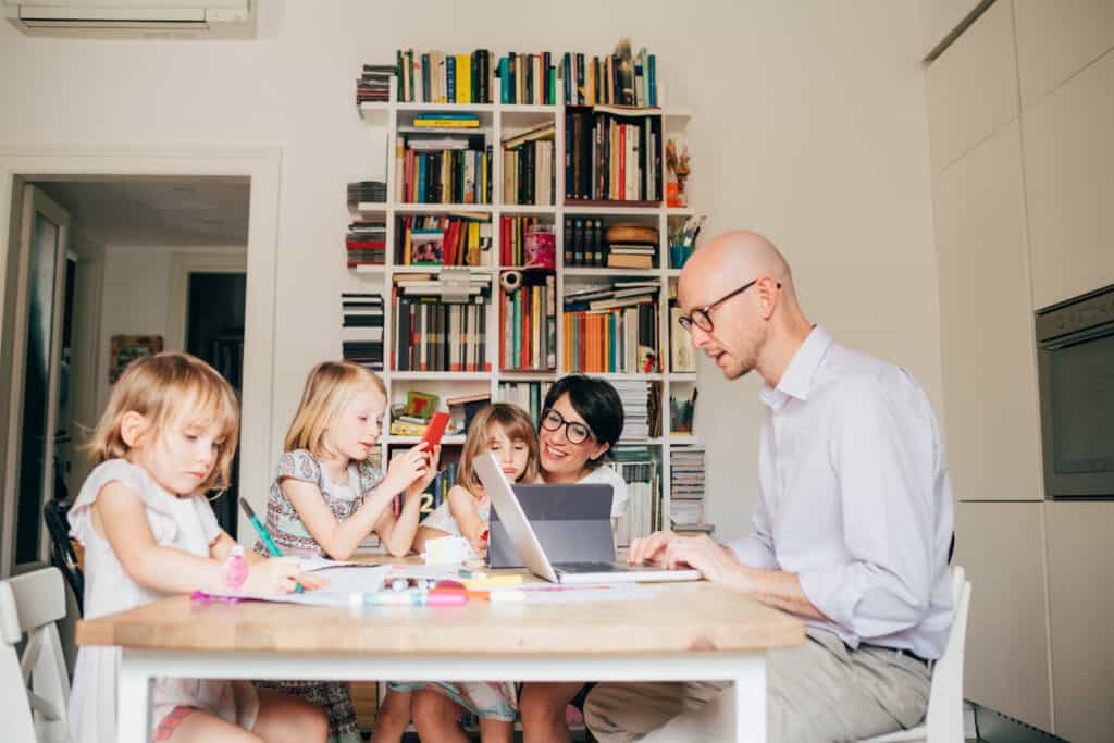 A family of accidental homeschoolers hard at work.
