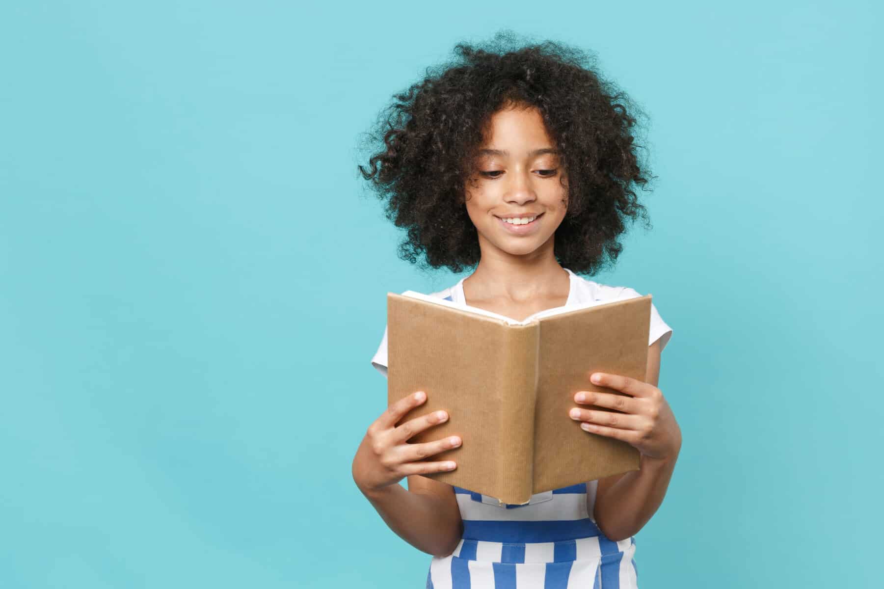 A child with a learning difference such as dyslexia learning to read