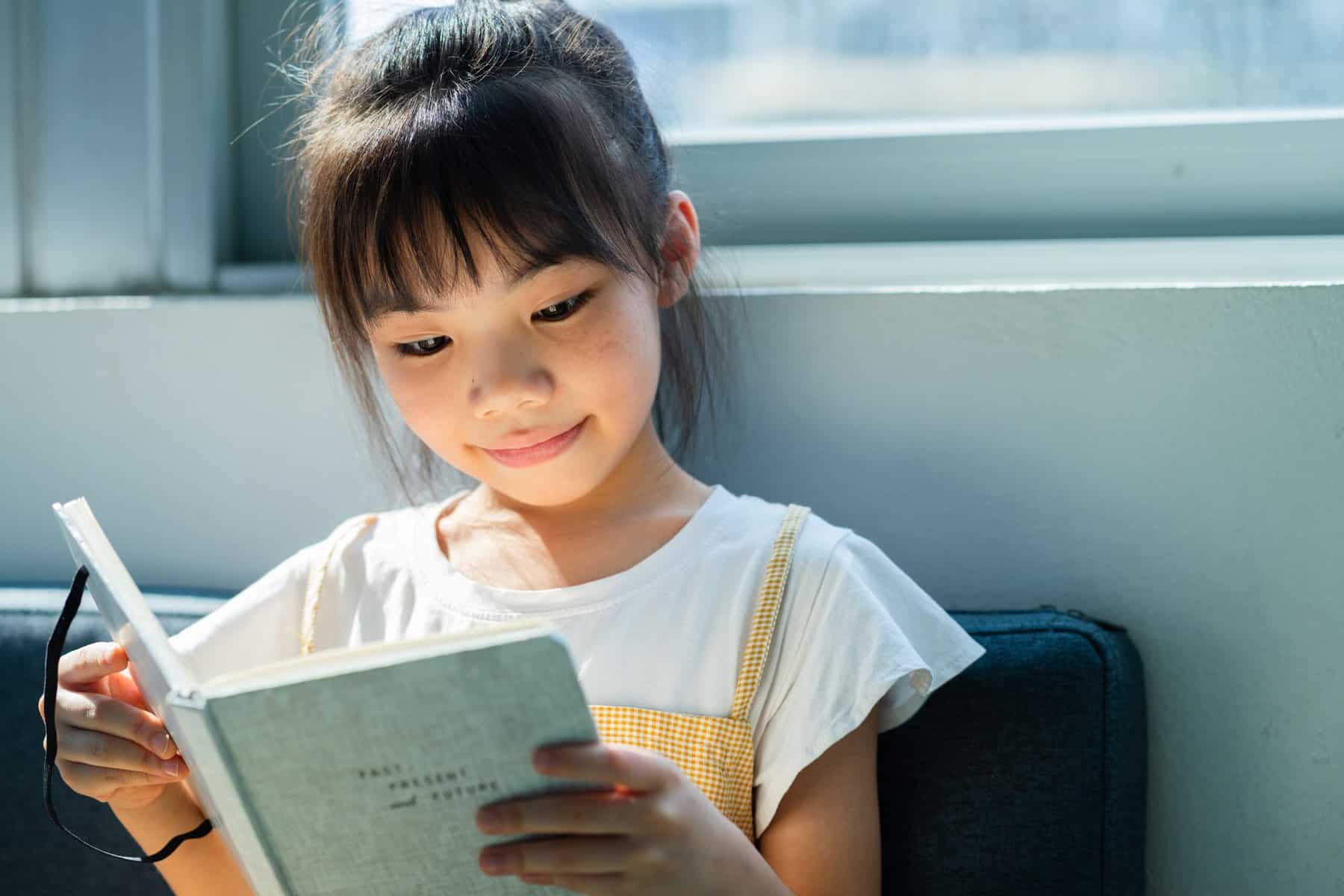 A child with ADHD reading