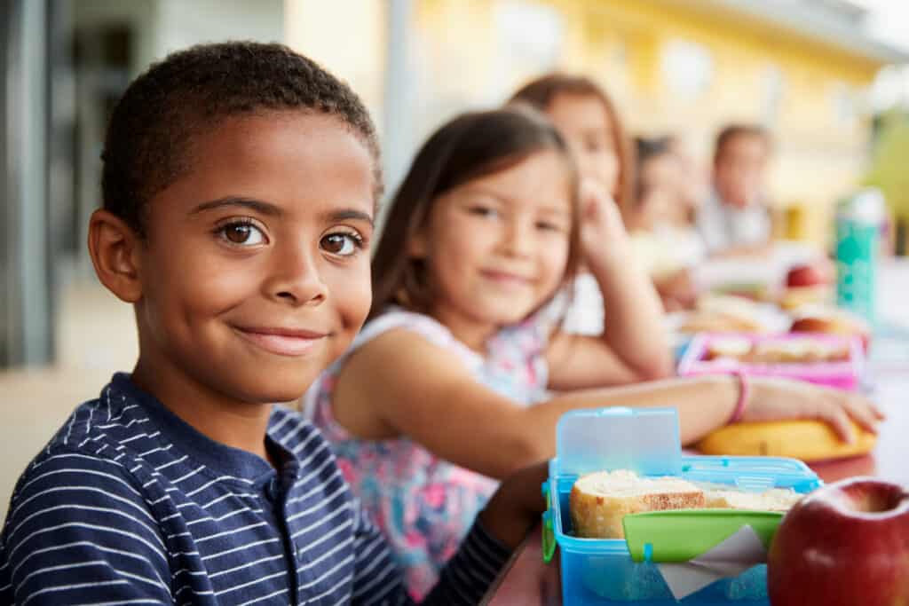 Young boy sitting at a table at school