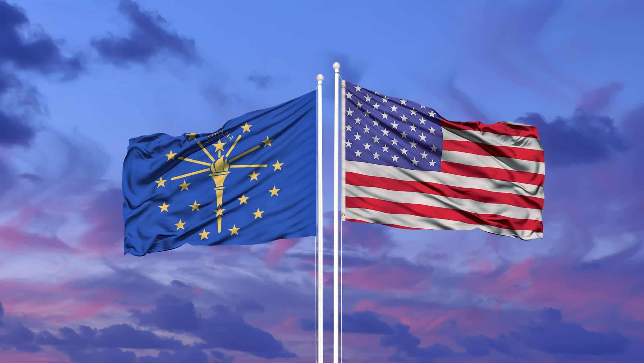 image of Indiana flag and American flag together at sunset