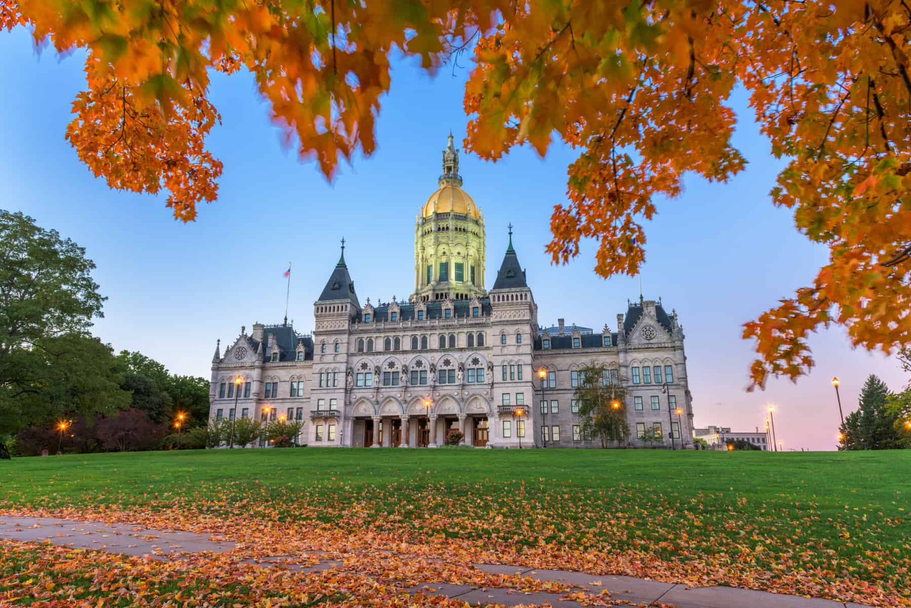 Image of the Connecticut State Capitol with fall leaves