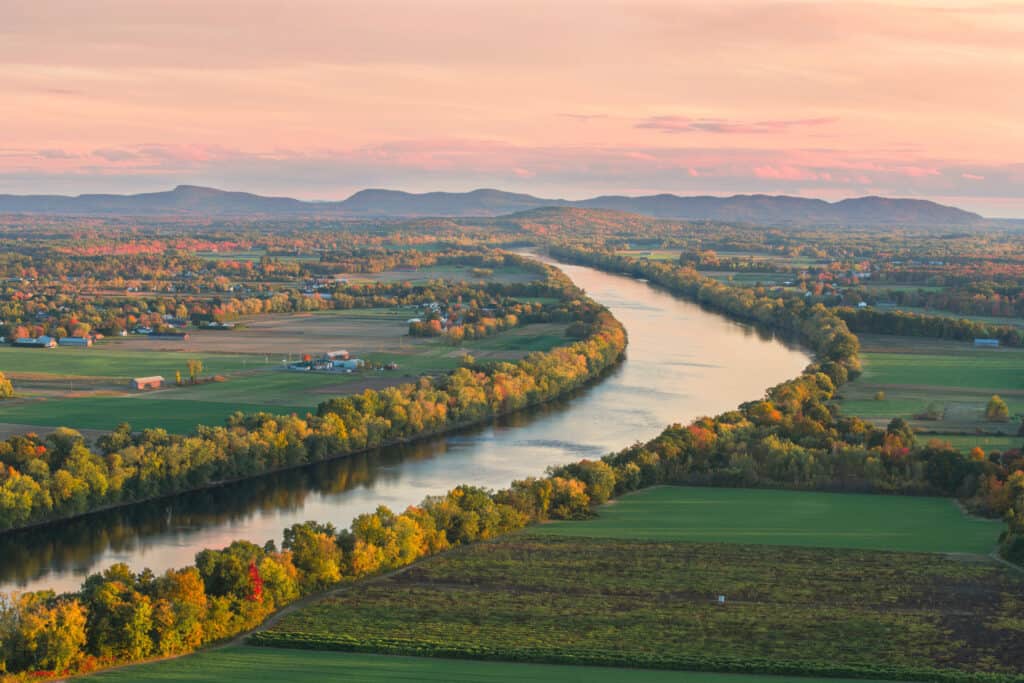 Image of Sugarloaf Mountain overlooking the Connecticut River at sunset in autumn