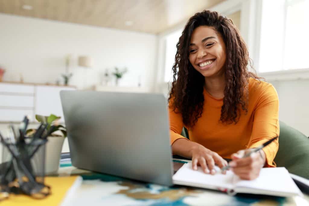 High school girl using her laptop for school