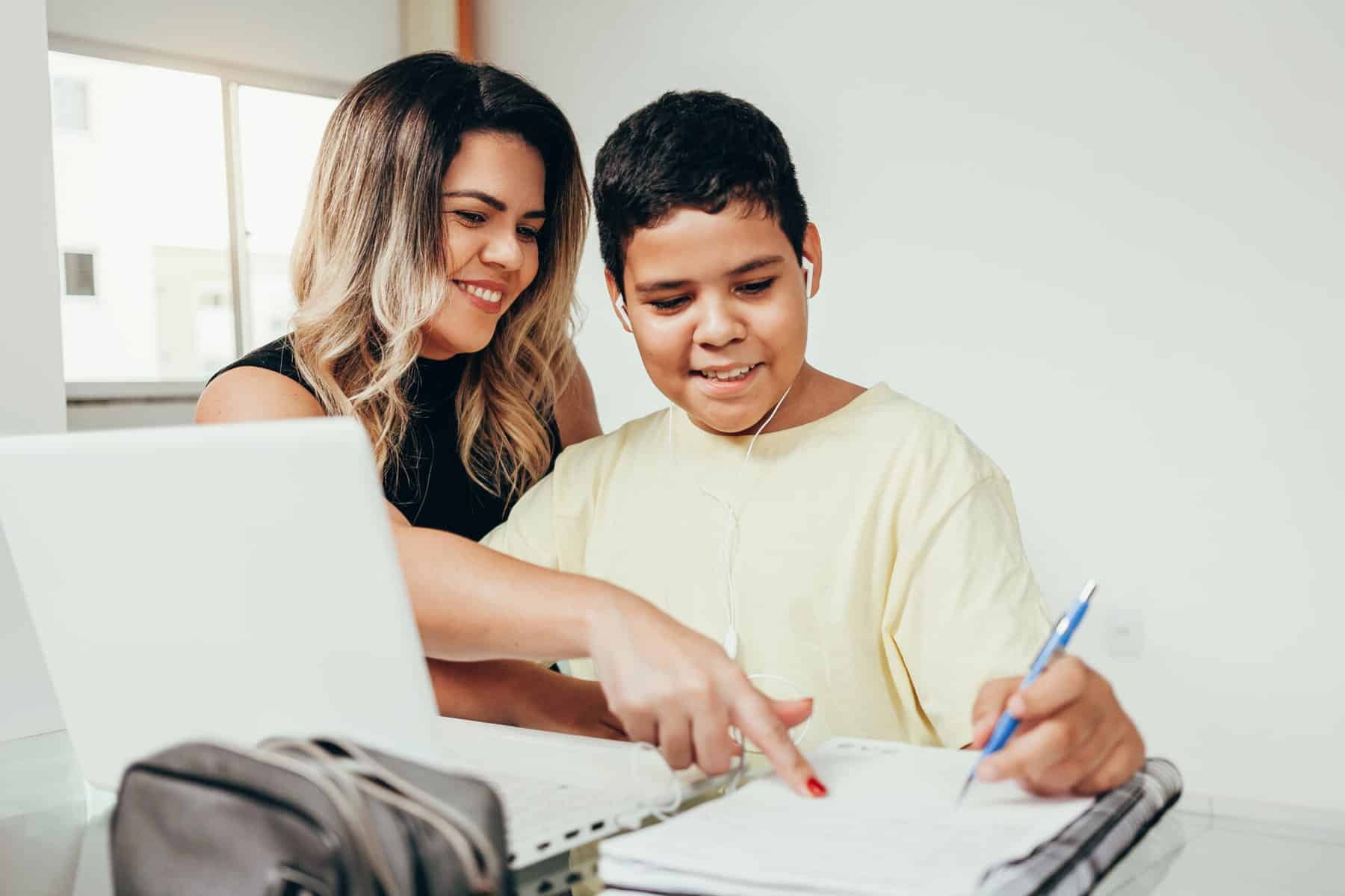 Mom and son work on homework together