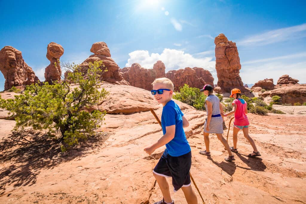 Group of children hiking in the desert