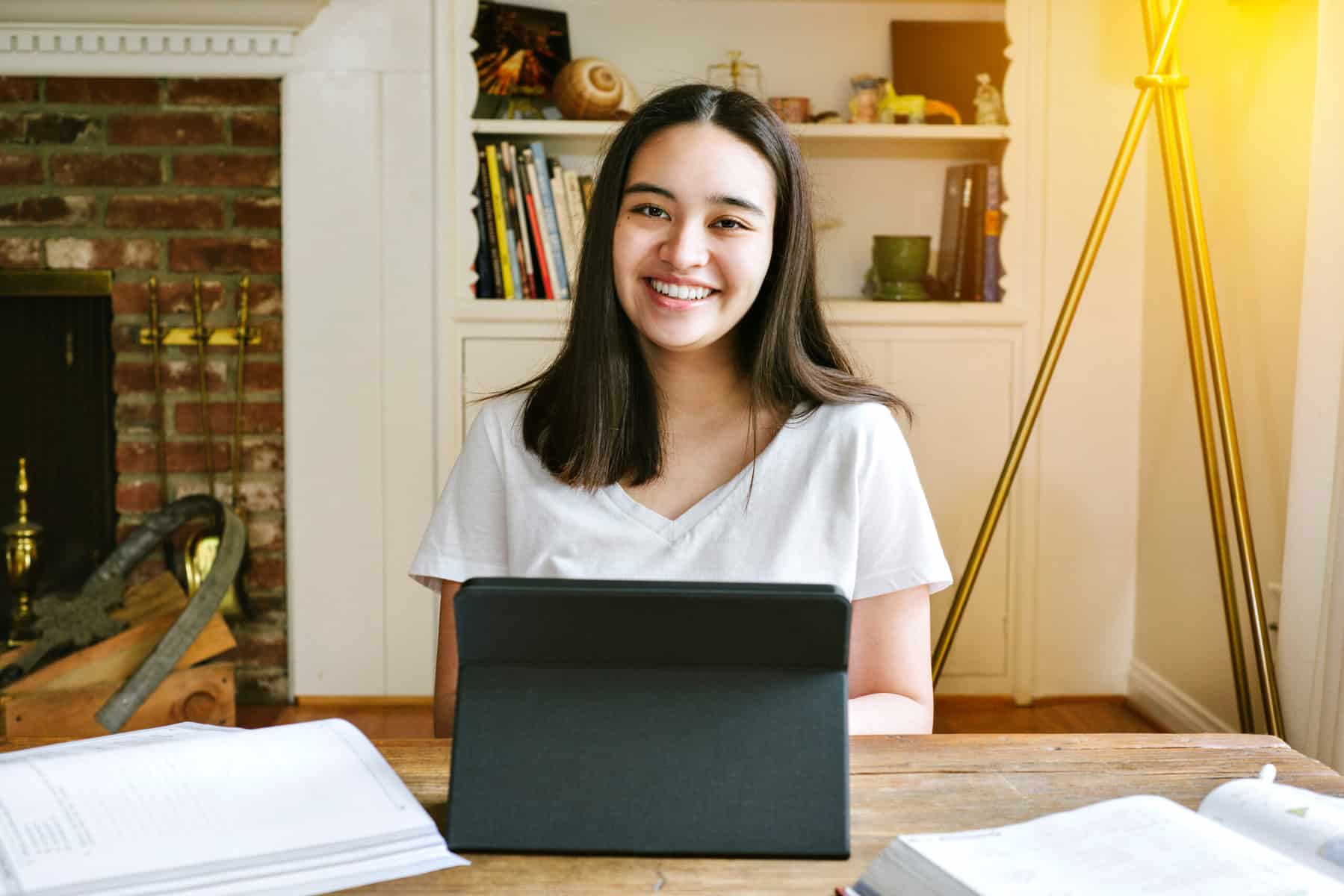 Young woman smiling at a laptop