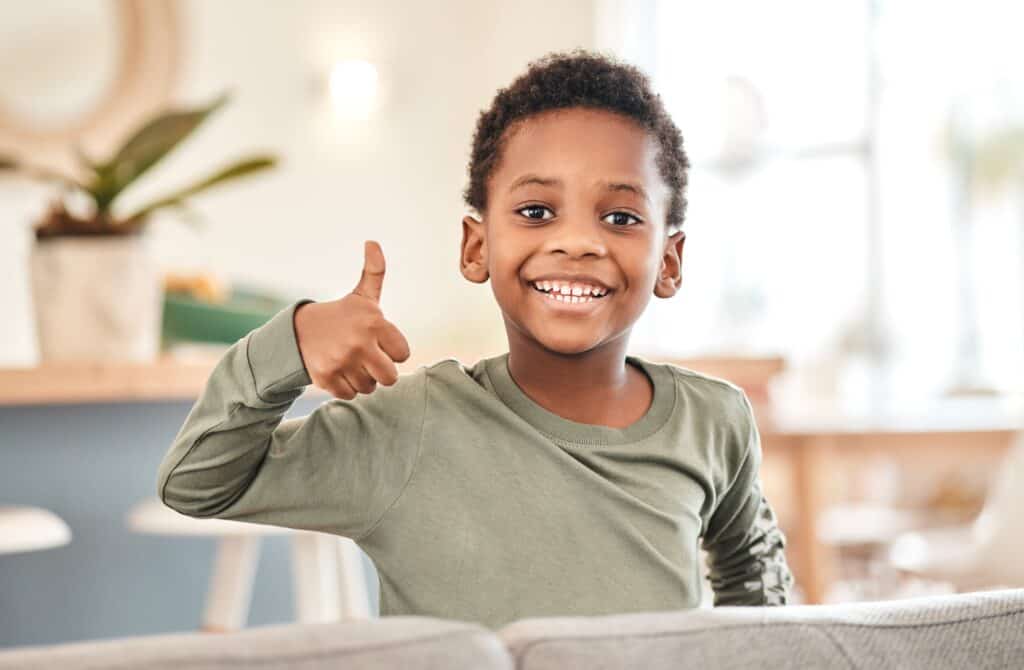 Young Black student giving a thumbs up