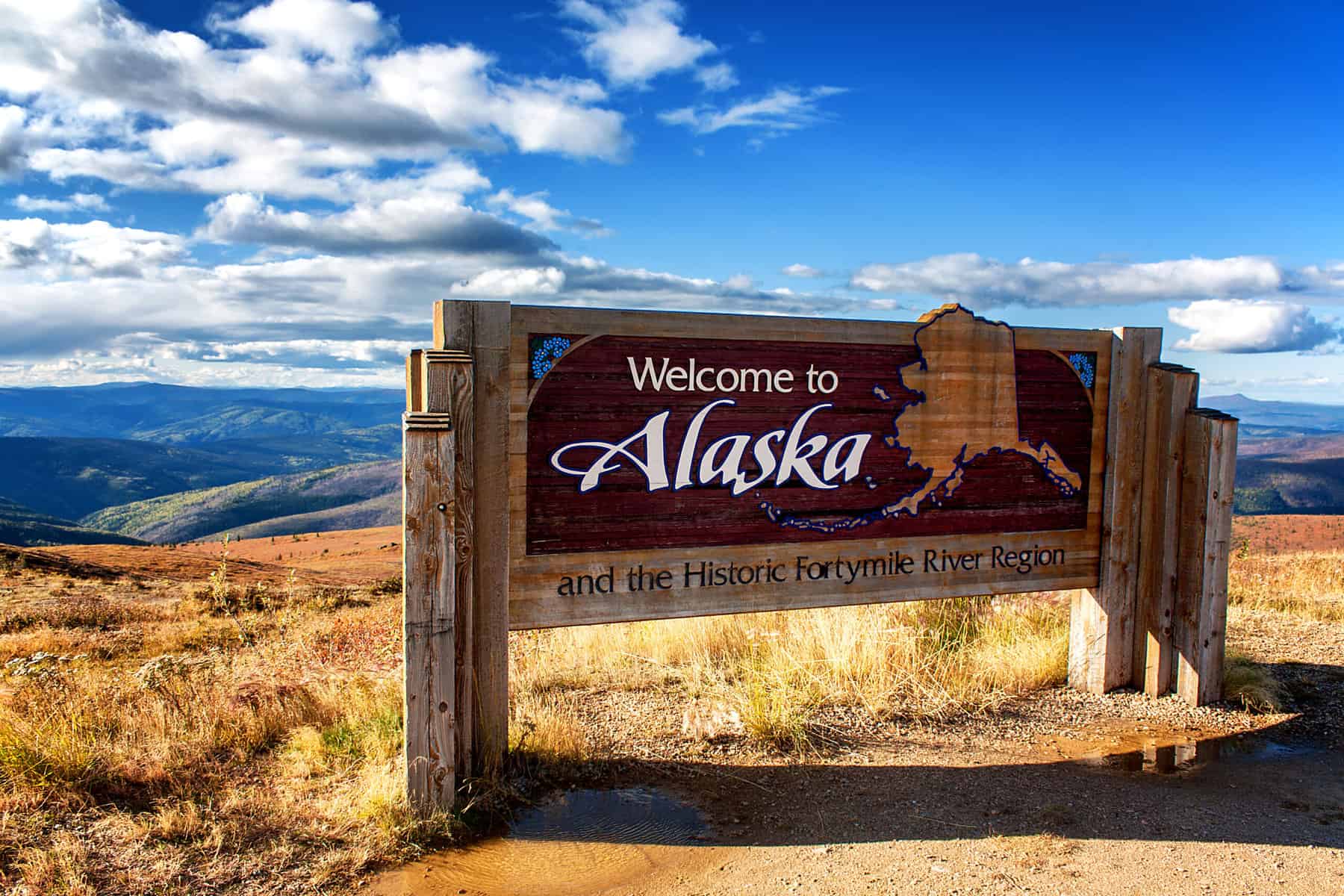 Image of road sign that says Welcome to Alaska