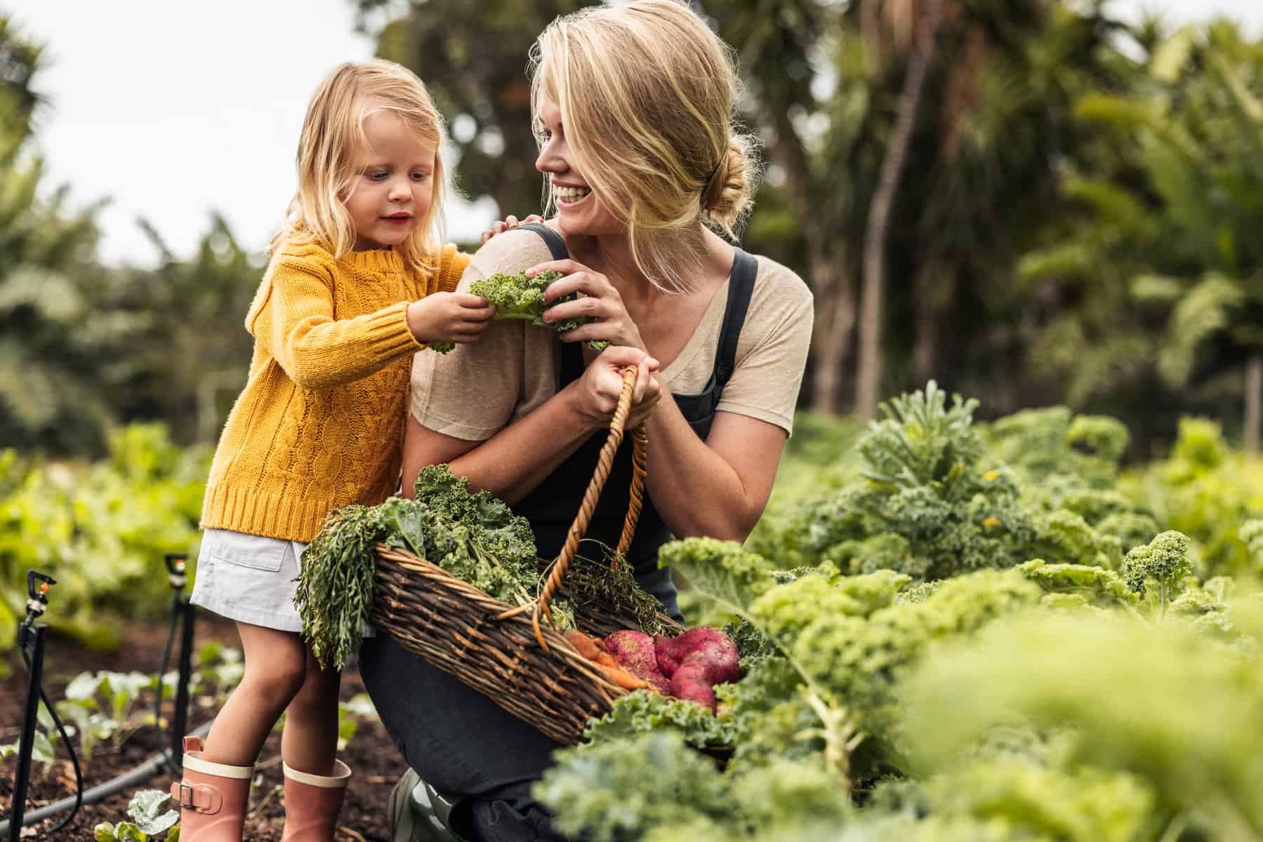 Mom and daughter gardening together